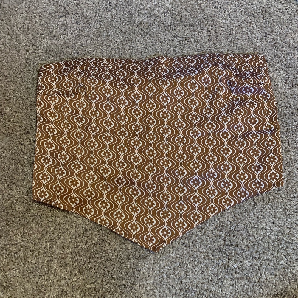 Strapless shirt, Color brown and white with designs, Size small, from holster.